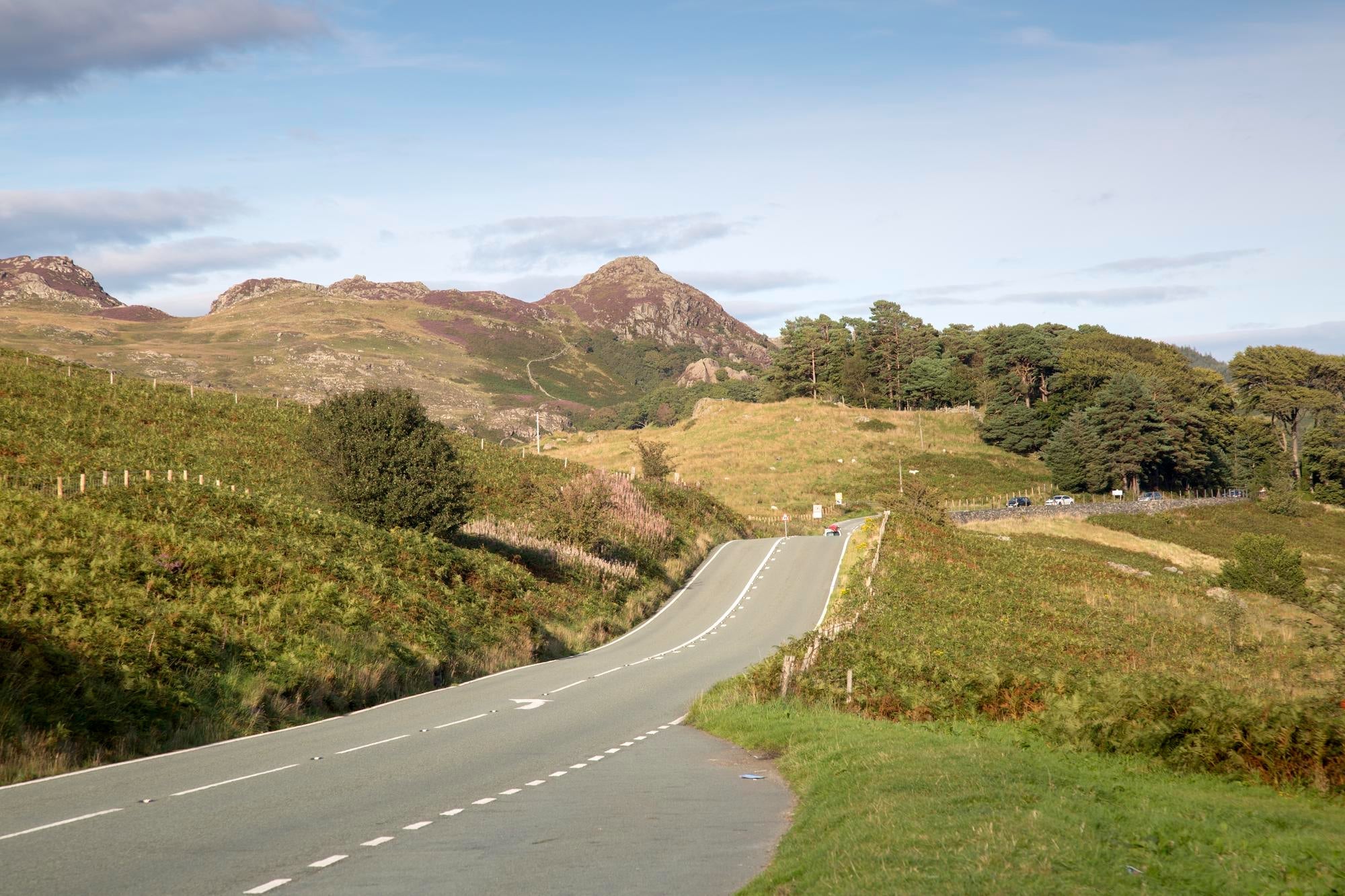 Road showing snowdonia in Wales in the background